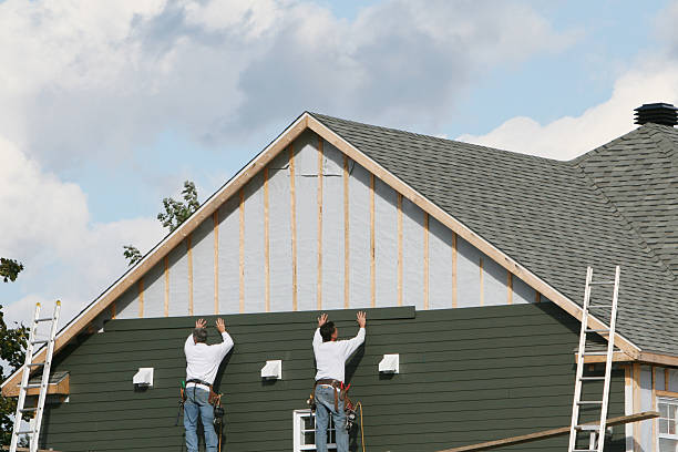 Professional Siding Installation technician working in Hartville, OH